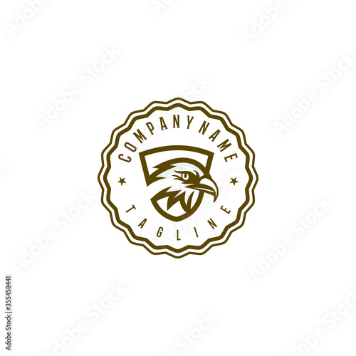 Golden eagle logo design template. Awesome a golden eagle with shield logo. A golden eagle circle lineart logotype.