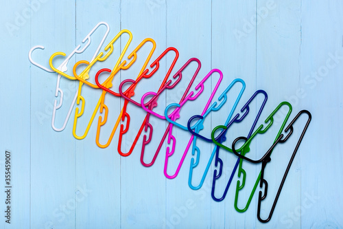 Colorful hangers behind one another