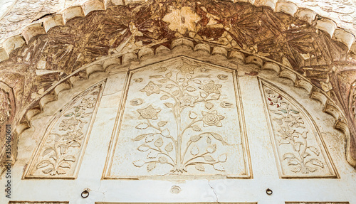 Artwork on marble at the Bibi ka Maqbara, built by Azam Shah in 1678, as a son's tribute to his mother, Begum Rabia Durrani, the Queen of Mughal emperor Aurangzeb. Aurangabad, Maharashtra, India photo