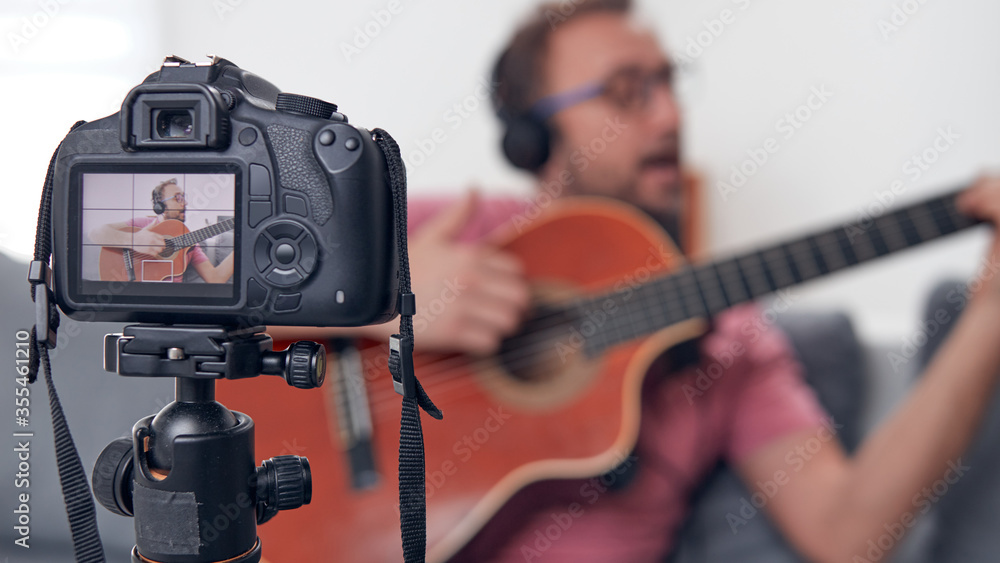 Guitarist making video lessons and tutorials for internet vlog website classes. Guitarist making video lessons and tutorials for internet vlog website classes.