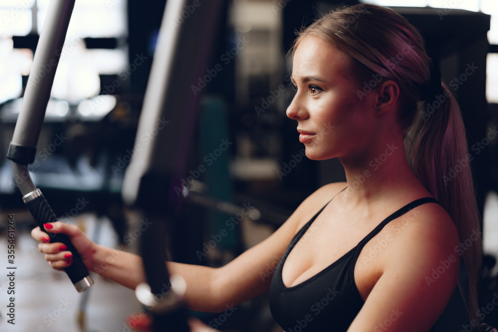 Young caucasian blonde woman training hands in a gym Young caucasian blonde woman training hands in a gym