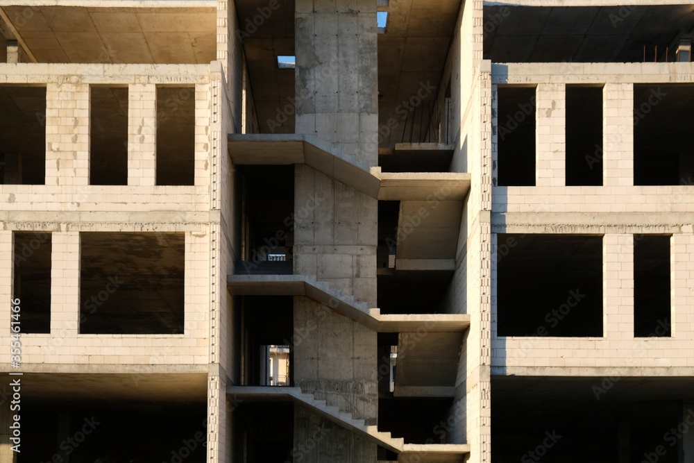 Construction of a new unfinished residential building. View of the stairs structure. Construction of a new unfinished residential building. View of the stairs structure.