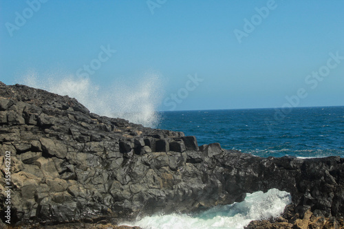 waves hitting the rock
