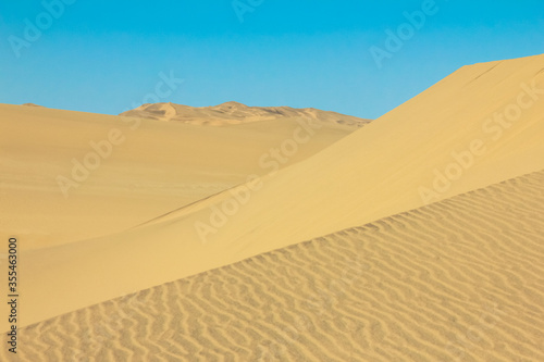 Big sand dunes panorama. Desert and coastal beach sand landscape scenery. Abstract background.