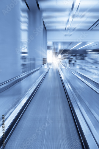 modern escalator with motion blur