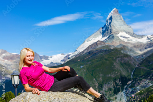 Woman hikers in the Alps, Matterhorn peak in Switzerland