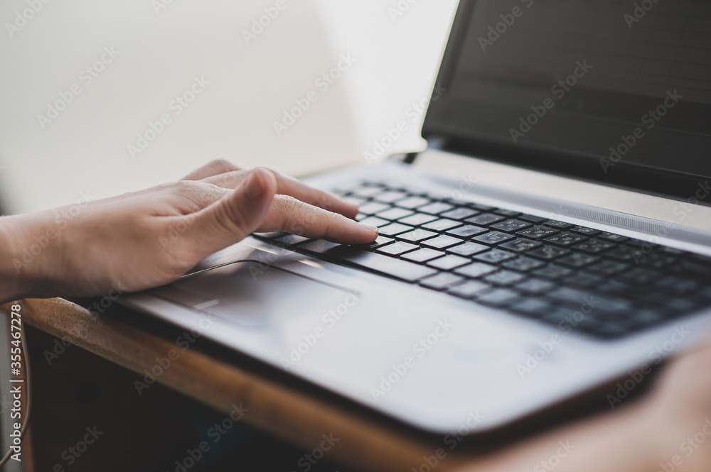 Close up hand typing on computer key board Close up hand typing on computer key board