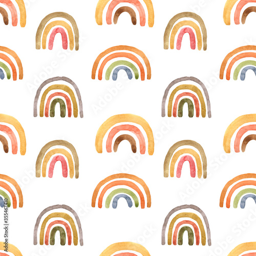 Childish cute seamless pattern with watercolor pastel pink, terracotta, burnt orange and yellow naive rainbows on white background. Hand painted illustration in scandinavian style. Boho arch print