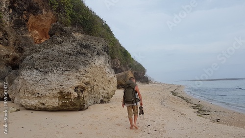 walking on the beach with pack