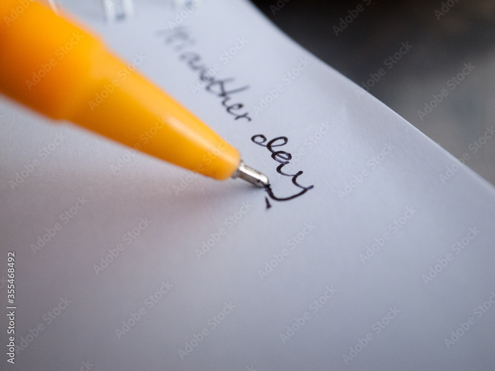 Fototapeta premium A yellow pen on a blank page notebook.