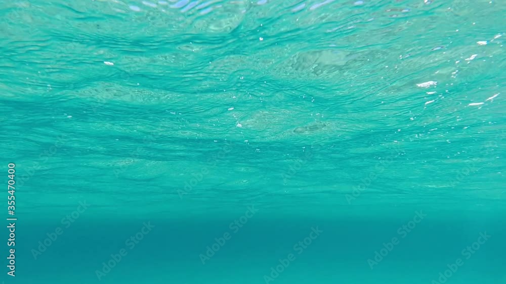 Slow motion video of calm turquoise sandy exotic sea bed Slow motion video of calm turquoise sandy exotic sea bed