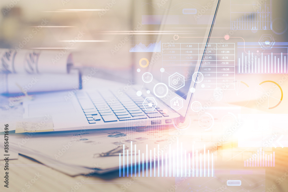 Fototapeta premium Double exposure of laptop computer and technology theme hologram. Concept of freelance work.