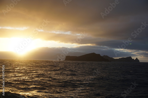 Sunset view on Ponta de Sao Laurenco from the ferry, october 2019 photo