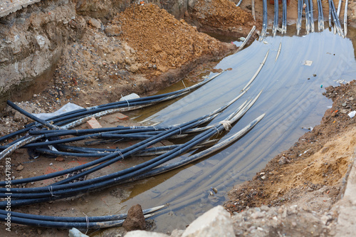 Cable cord laying in subsoil waters at construction site