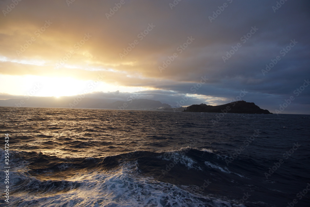 Sunset view on Ponta de Sao Laurenco from the ferry, october 2019
