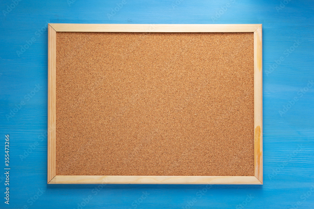Fototapeta premium cork board on wooden background