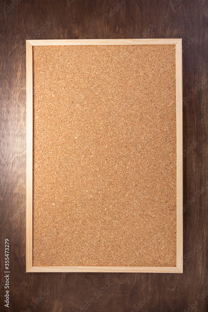 Fototapeta premium cork board on wooden background