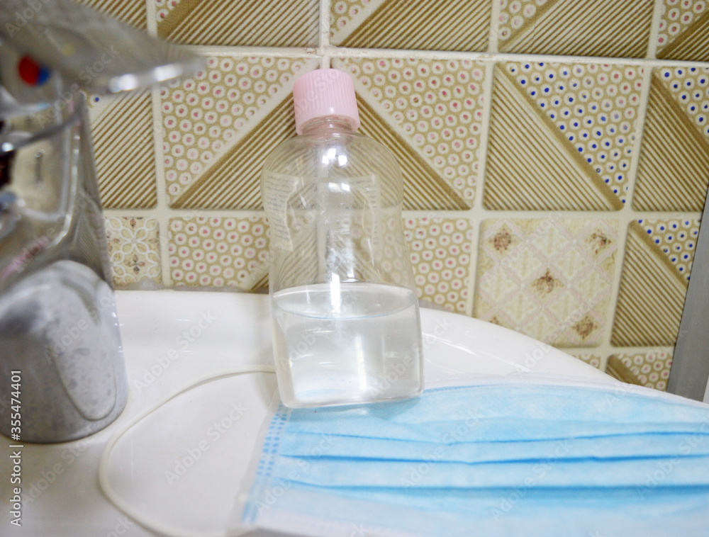 Corona virus prevention medical surgical masks and hand sanitizer gel for cleaning hygiene protection corona virus or antibacterial. Corona virus prevention medical surgical masks and hand sanitizer gel for cleaning hygiene protection corona virus or antibacterial.