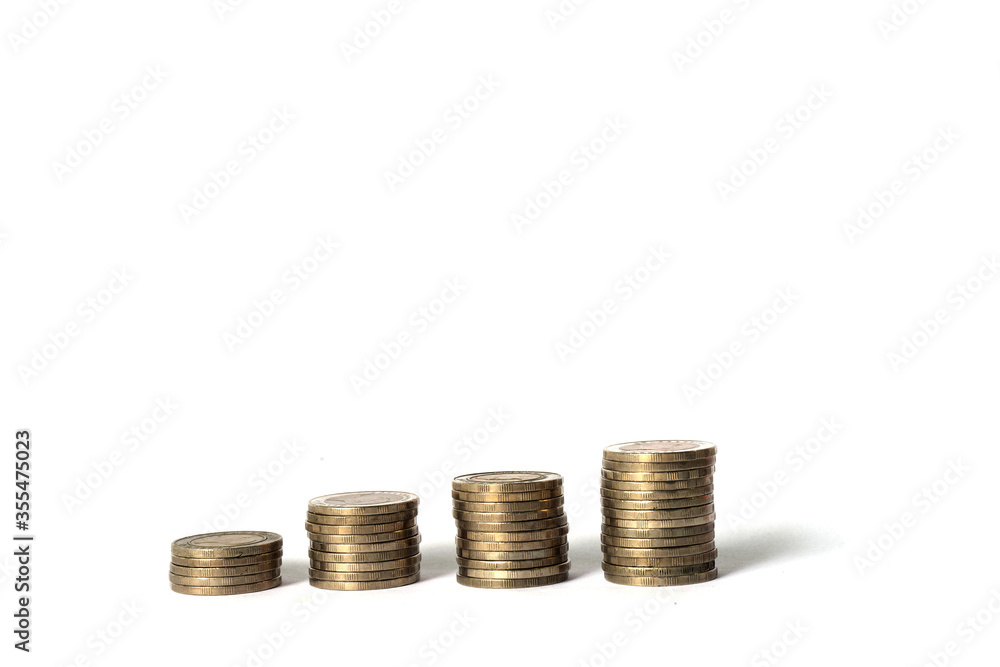 Stack of four stick coins, similar to the bar chart. On a separate isolated white background. There is a shadow of each stack of coins. Concepts of financial management. Stack of four stick coins, similar to the bar chart. On a separate isolated white background. There is a shadow of each stack of coins. Concepts of financial management.