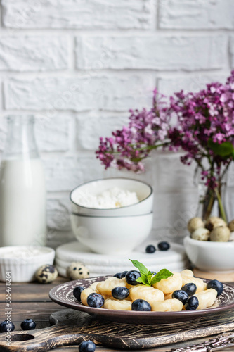 Lazy cottage cheese dumplings with fresh berry. Simple and healthy breakfast