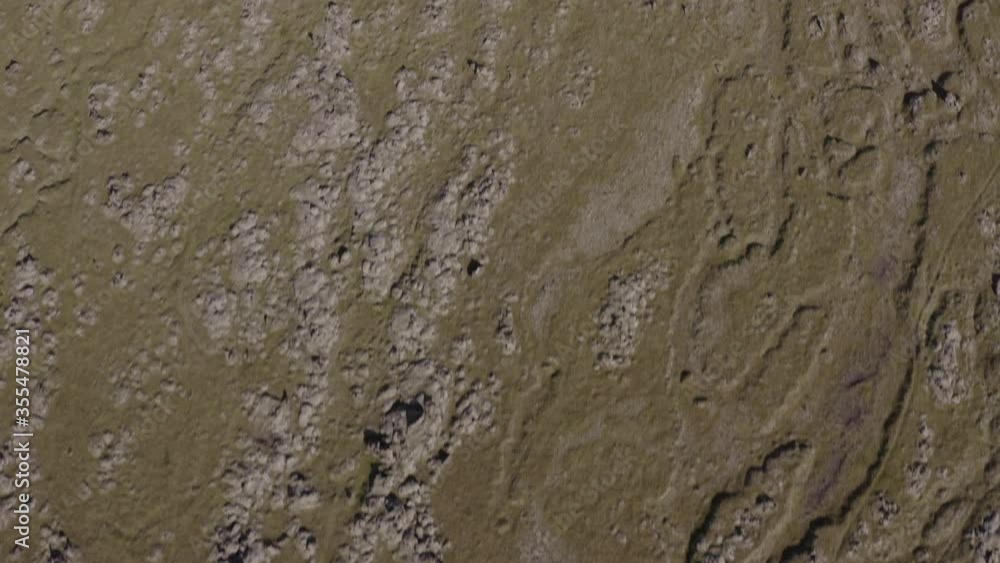Aerial shot of rocky landscape on sunny day, drone flying forward over natural pattern - Southwestern Iceland, Iceland Aerial shot of rocky landscape on sunny day, drone flying forward over natural pattern - Southwestern Iceland, Iceland