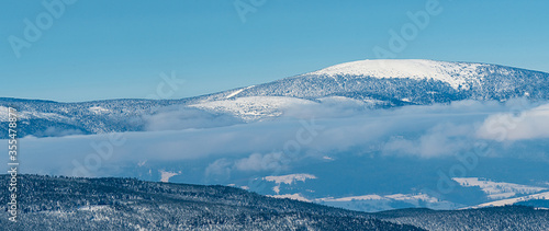 Kralicky Sneznik hill on czech - polish borders during beuatiful winter day © honza28683