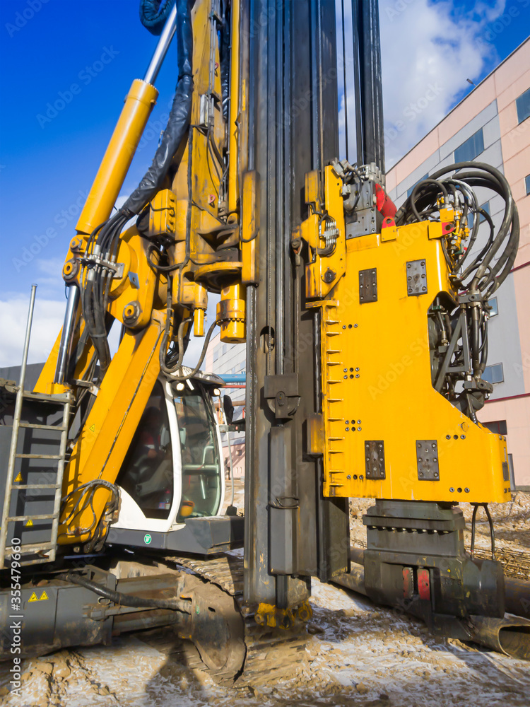 Powerful hydraulic drilling rig. Drilling and piling. Foundations in construction. Geology. Vibratory immersion.