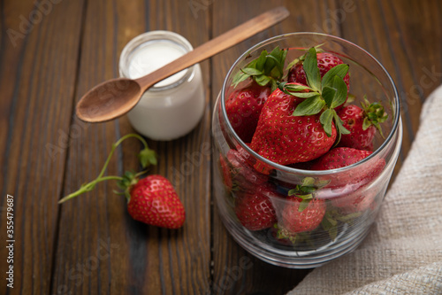 ripe farm strawberries on a wooden background