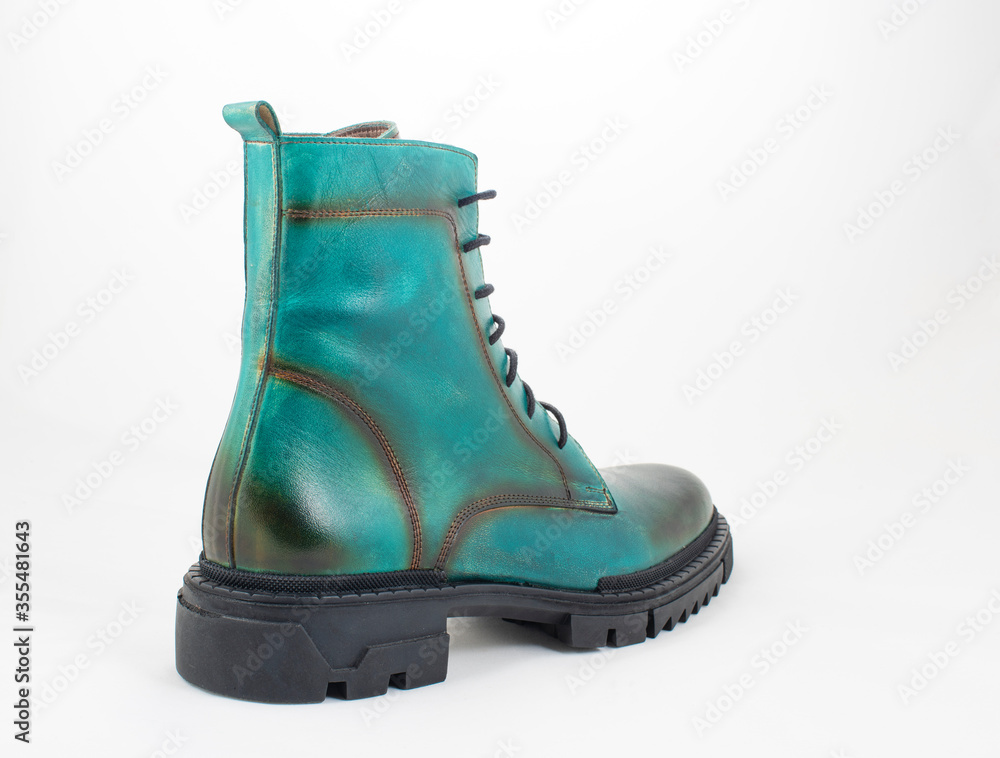 close up of green leather boot isolated on white background close up of green leather boot isolated on white background