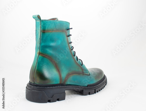 close up of green leather boot isolated on white background