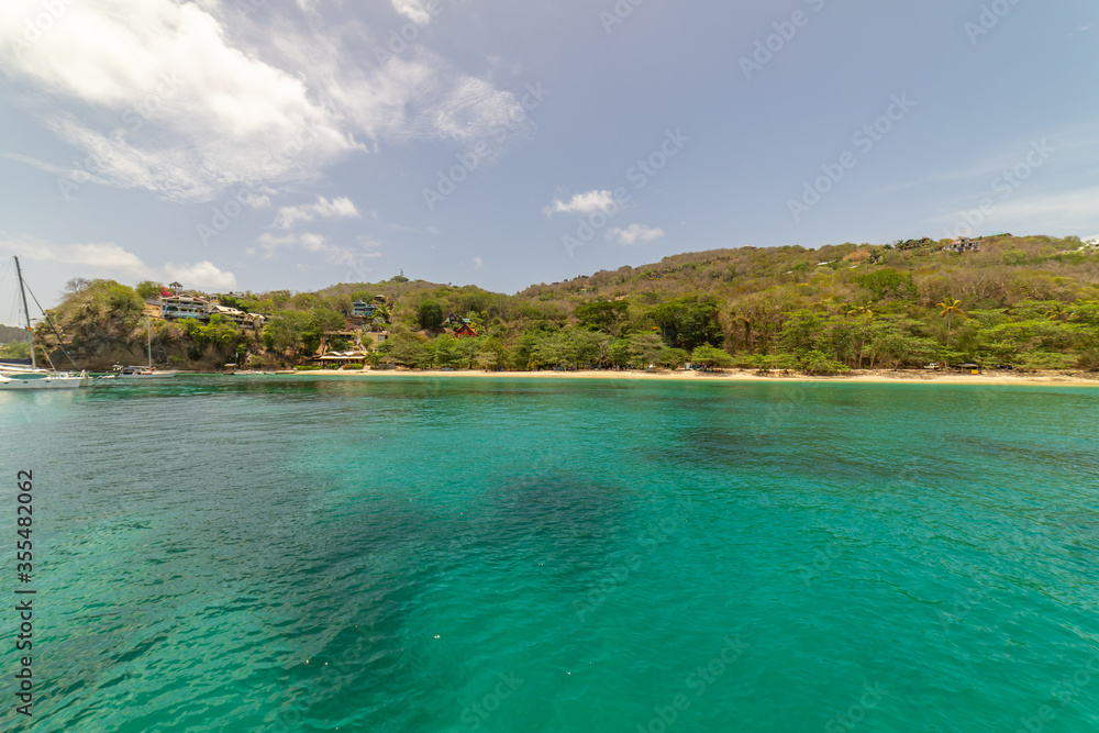 Wide angle view of Princess Margaret bay with hills in the background, Bequia, Saint Vincent and the Grenadines Wide angle view of Princess Margaret bay with hills in the background, Bequia, Saint Vincent and the Grenadines