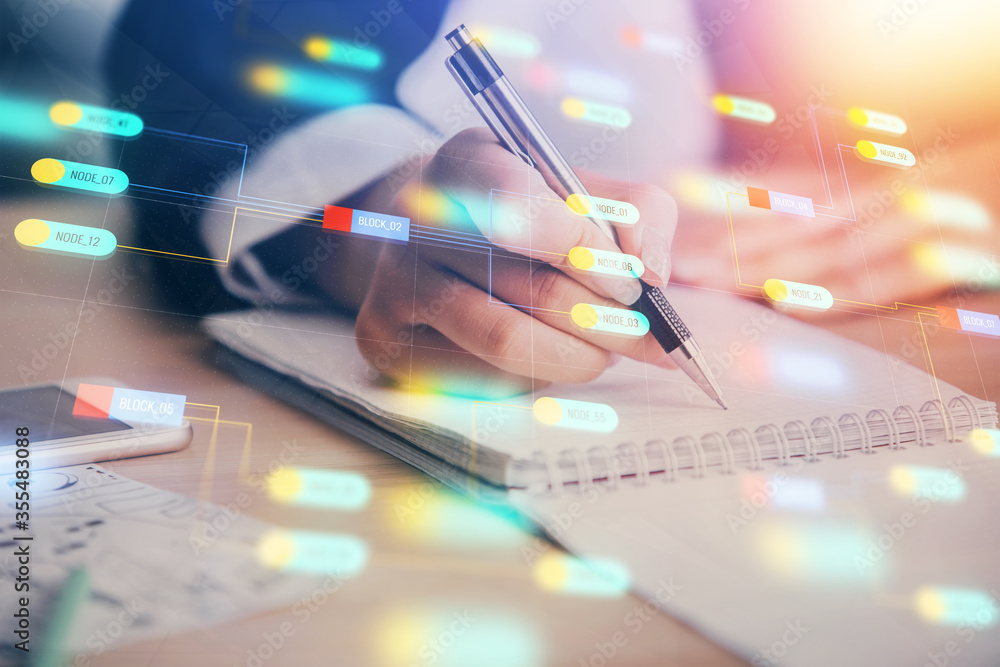 Double exposure of writing hand on background with data technology hologram. Big data concept. Double exposure of writing hand on background with data technology hologram. Big data concept.