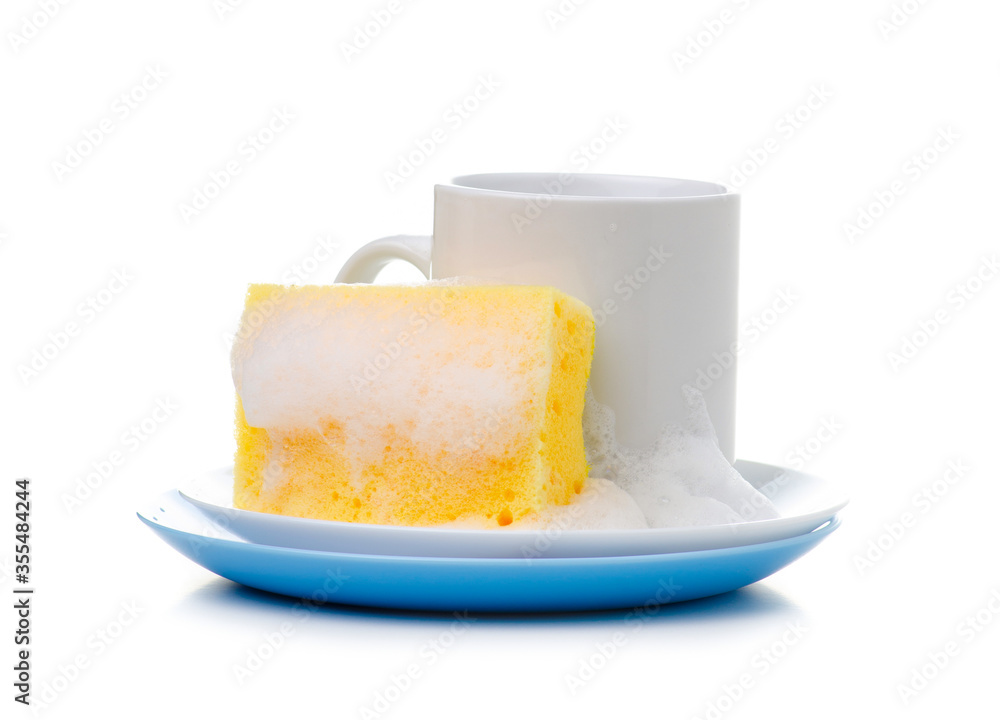 White plate, cup with cleaning sponge with soap foam on white background isolation