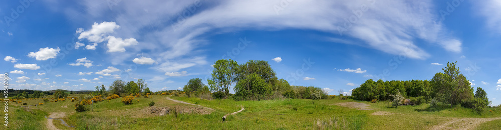 scenic panorama view of natural landscape under a cloudy sky scenic panorama view of natural landscape under a cloudy sky