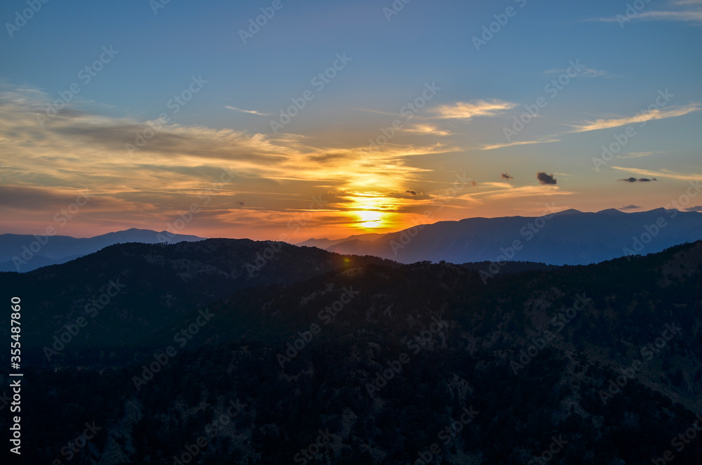 Beautiful mountain landscape with sunset over Taurus Mountains from the top of Tahtali Mountain near Kemer, Antalya, Turkey. 
