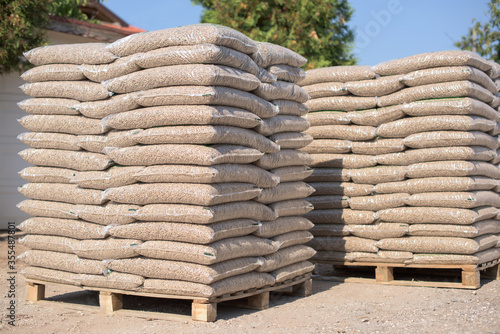 Bild auf Leinwand Many sacks that are filled with pellets placed on pallets