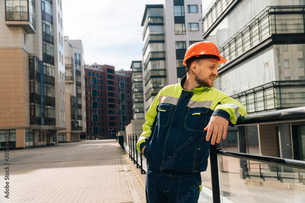 a clean builder shows sincere emotions of indignation. Man in special clothes and helmet shows hostility a clean builder shows sincere emotions of indignation. Man in special clothes and helmet shows hostility