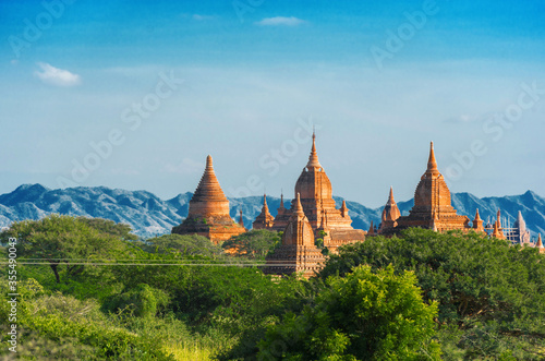 View of Ancient Pagodas inside a Forest in Bagan  Myanmar. Background a Mountain Landscape  Copy space for text