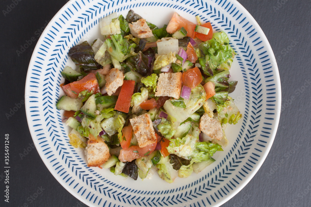 A colorful Arabic Fattoush salad served in a dish