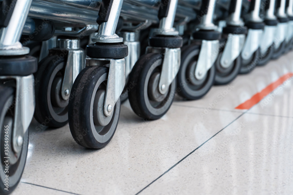 A row of carts in a supermarket. Carts for luggage. A row of carts in a supermarket. Carts for luggage.