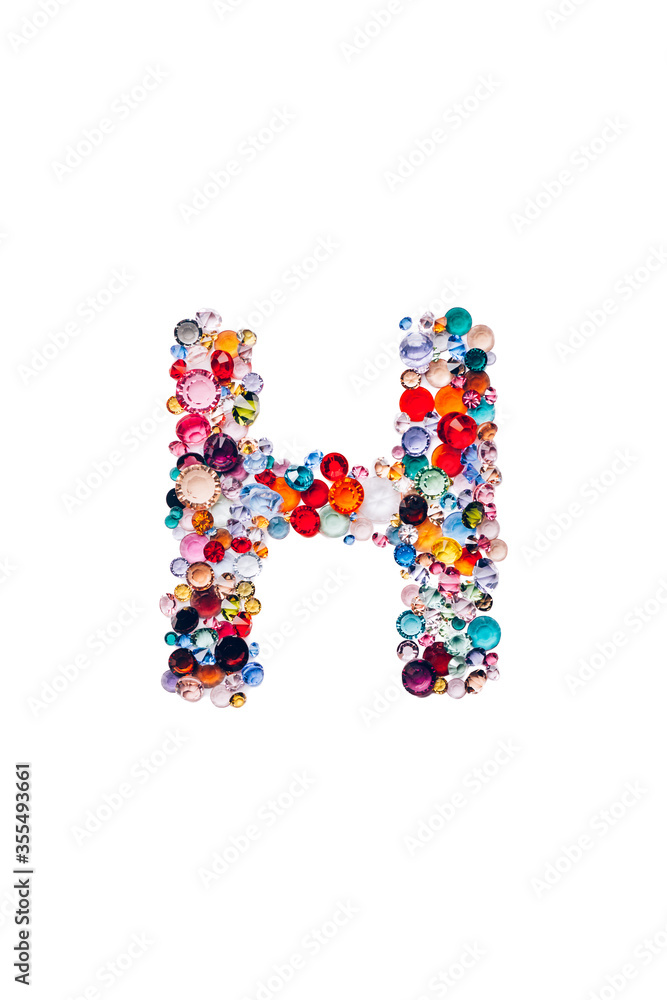 Letter H made from beautiful glass bright gems or crystals on isolated white background