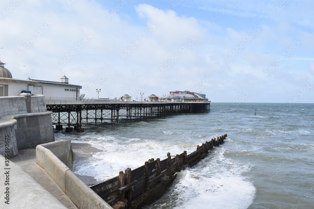Cloudy skies over Cromer Pier, on the North Norfolk coast, England, UK.
