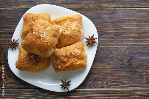 Balkan cuisine. Mantije ( manti ) -  filled pastry,  popular national dish. Flat lay. Free space for text photo