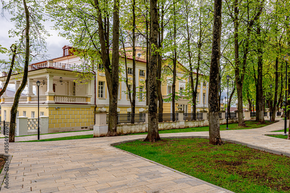 Spring park with stone walkways and benches