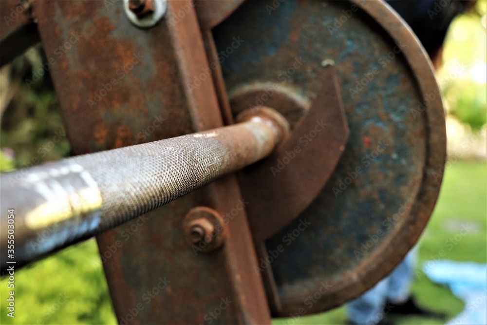 close up of an old rusty metallic dumbles