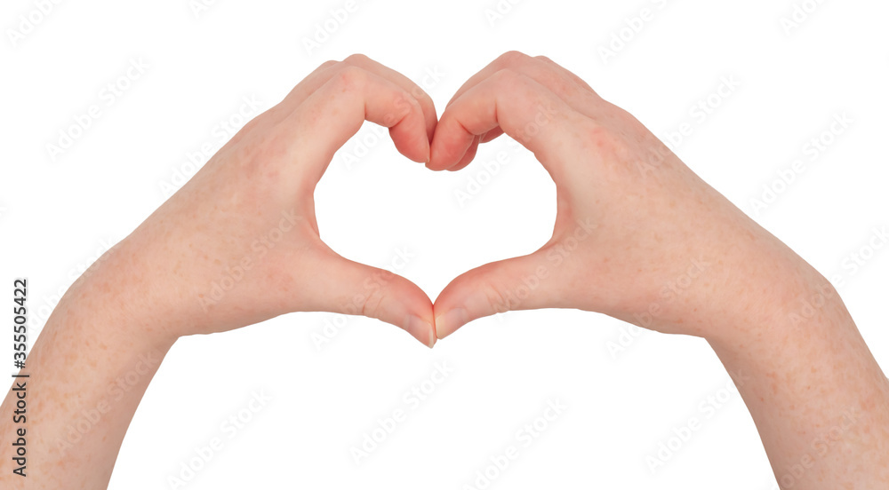 Freckled white hands. Hands making a heart or love shape frame between thumb and index finger with fingers together. Female hand isolated Freckled white hands. Hands making a heart or love shape frame between thumb and index finger with fingers together. Female hand isolated
