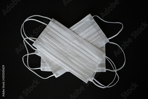 White surgical mask, to prevent viruses, influences and against contamination in cities