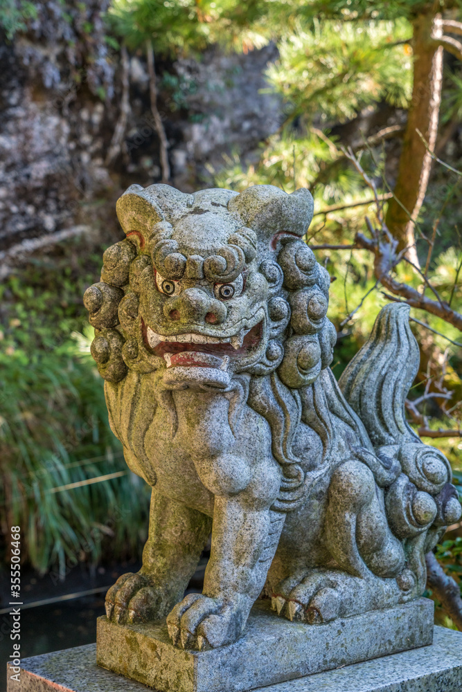 Agyou (Open Mouth) Stone carved Komainu Lion-Dog guardian in Kamakura, Kanagawa Prefecture, Japan.