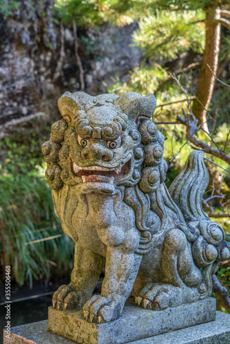 Agyou (Open Mouth) Stone carved Komainu Lion-Dog guardian in Kamakura, Kanagawa Prefecture, Japan.