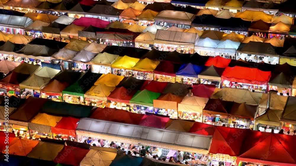 Ratchada Rot Foi Train night market in Bangkok, Thailand with rows of